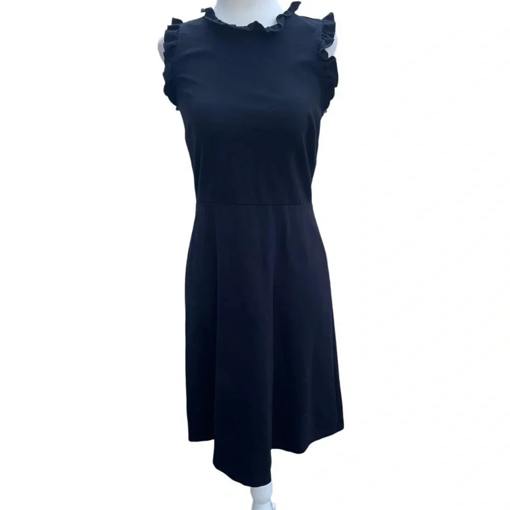 Loft sleeveless little black dress, size 0. Ruffles at collar and armholes.